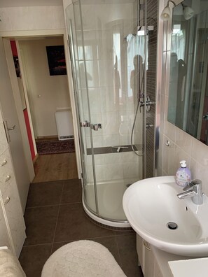 Bathtub, hair dryer, towels, soap