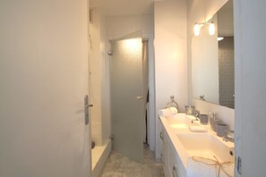 Shower, hair dryer, towels, toilet paper