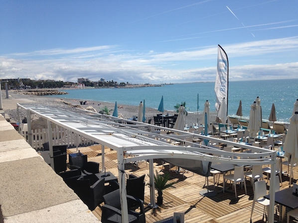 On the beach, sun loungers, beach towels