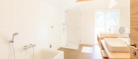 Bathtub, hair dryer, towels, soap