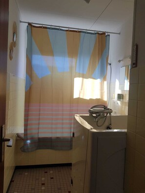 Combined shower/tub, hair dryer