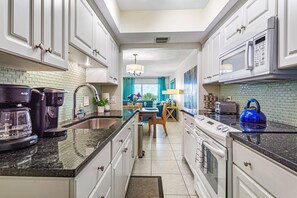 Fridge, microwave, oven, stovetop - Beachfront Madeira Norte | Gulf front | Pool (Madeira Beach)