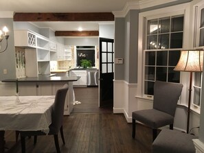 Enjoy meals in the kitchen with a central island, dining area, and large window offering a view.