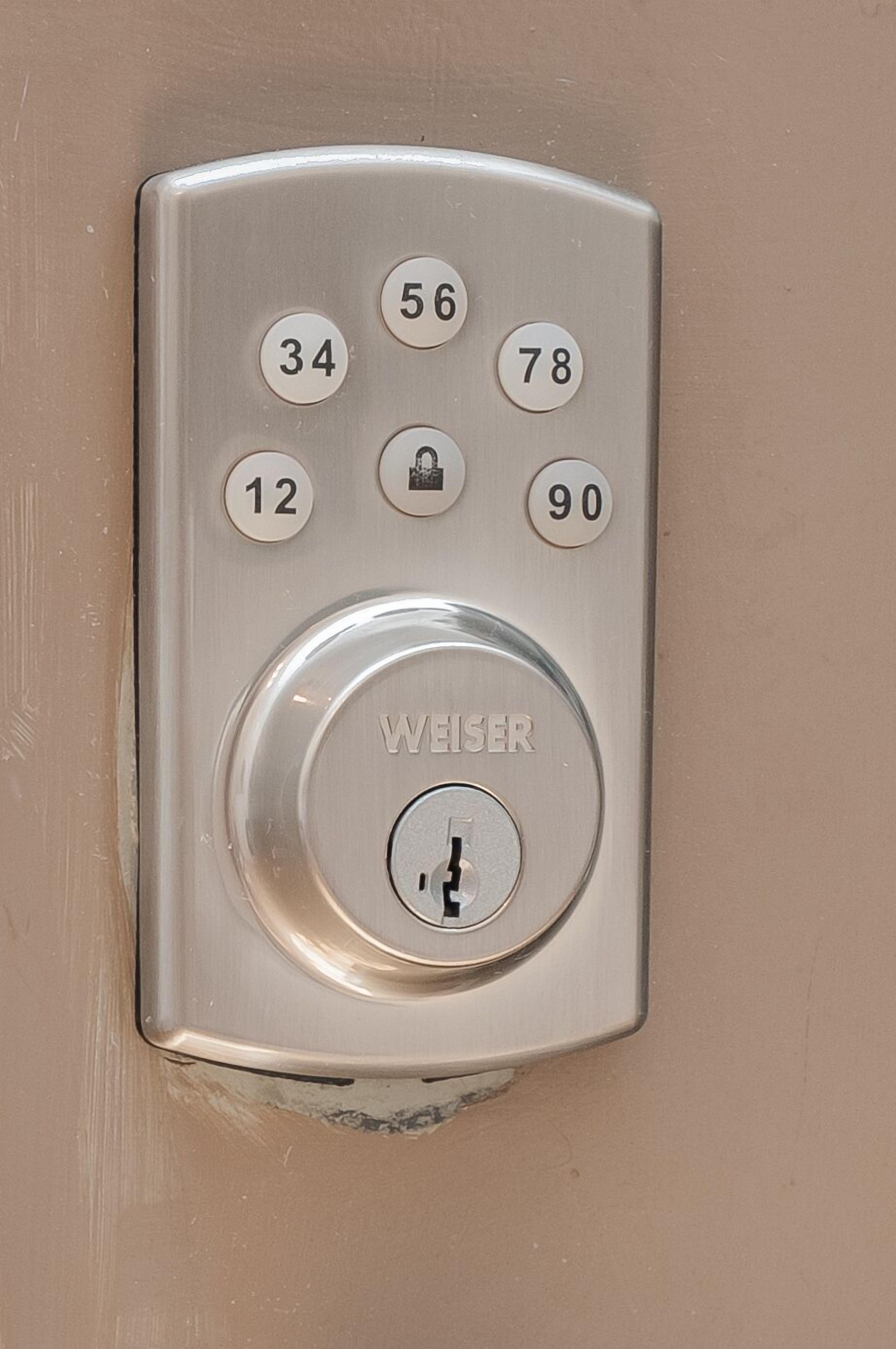 A keypad lock with numbers 12, 34, 56, 78, 90, and a "WEISER" brand lock.