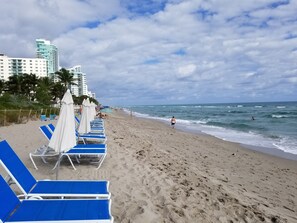 On the beach, sun-loungers, beach towels