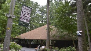 A covered outdoor area with a wooden roof, benches, and a sign indicating '2nd Street' and 'MT. GRETN 125'. - Mount Gretna Memories! 10 minutes to Renaissance Faire (Mt Gretna)