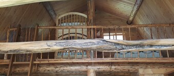 Rustic cabin hidden among the pines.