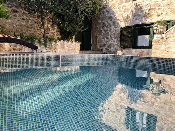 Seasonal outdoor pool, pool loungers