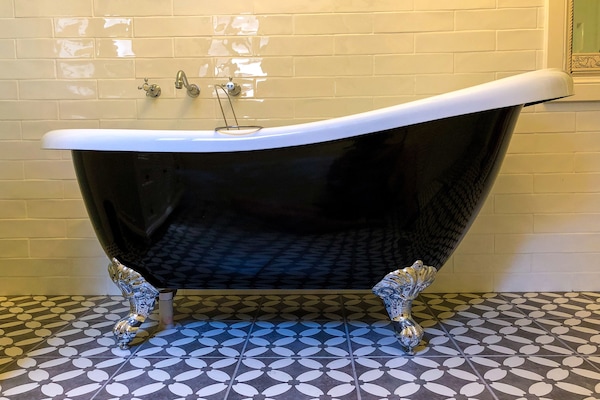 Relax in Inglenook's claw foot bathtub