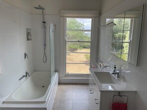 Combined shower/bathtub, towels, soap, toilet paper