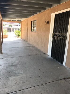 Walkway leads to the building entrance.