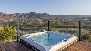 A hot tub on a wooden deck with a mountain view. - Exclusive Country Villa with Stunning Views & Infinity Pool (Restabal)