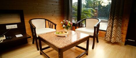 Deluxe Room, River View | Minibar, in-room safe, desk, laptop workspace