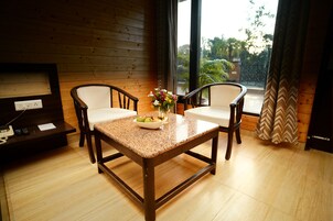 Deluxe Room, River View | Minibar, in-room safe, desk, laptop workspace