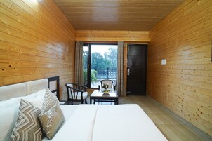 Deluxe Room, River View | Minibar, in-room safe, desk, laptop workspace