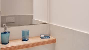 Shower, hair dryer, towels, toilet paper