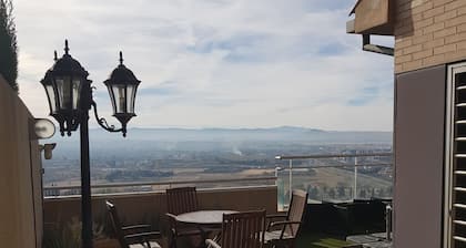 House in Granada with views and bus and commercial services.