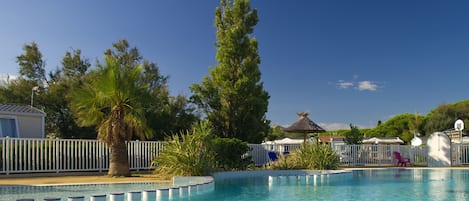 Seasonal outdoor pool, open 10:00 AM to 7:00 PM, pool loungers