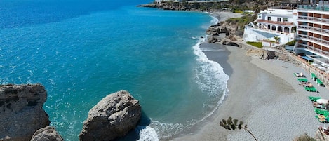 Beach nearby, sun loungers