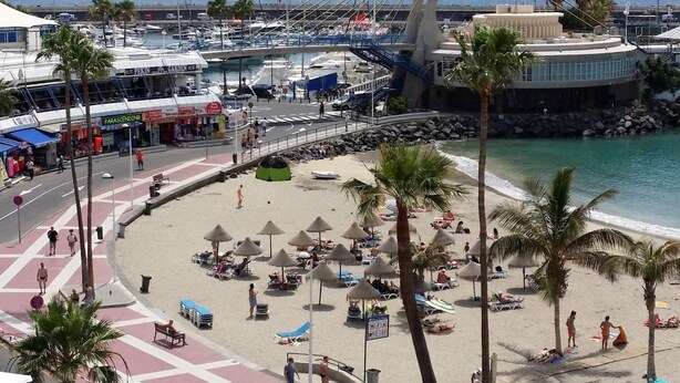 A coastal area with a marina, beach, and a bridge. - Studio Hotel Apt, in Costa Adeje, Few Minutes Walk To Beach, Shops & Bars (Costa Adeje)