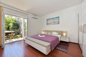 Family Apartment, Multiple Beds, Garden View | 2 bedrooms, free WiFi, bed sheets