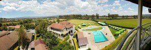 A residential area with a large house, a swimming pool, and a well-maintained lawn. - Lanet Matfam Resort (Nakuru)