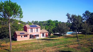A two-story house with a tiled roof, solar panels, and a swimming pool in the background. - EXCEPTIONAL site: SPACIOUS VILLA 8 BEDS, SWIMMING POOL 15x5M, SAUNA (Le Val)