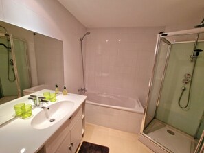 Combined shower/tub, hair dryer, towels, toilet paper