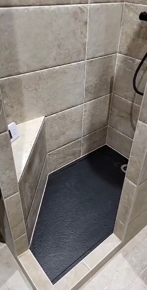 Bathtub, hair dryer, towels, soap