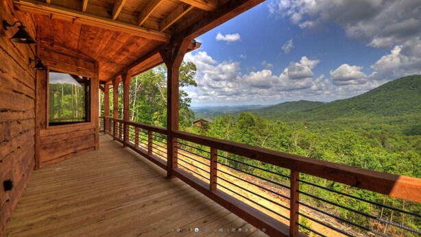 A wooden cabin with a balcony overlooking a forested landscape. - Luxury cabin! Designer decorated.  Incredible views! Amazing sunrise! Secluded!  (Blue Ridge)