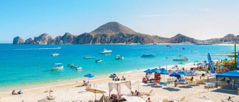 On the beach, sun-loungers, beach towels