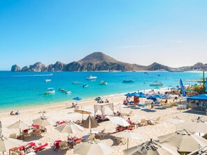 On the beach, sun-loungers, beach towels