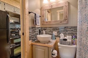 Combined shower/tub, hair dryer, towels, soap