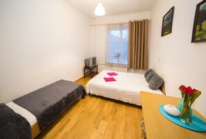 Departamento | 1 habitación, tabla de planchar con plancha, wifi gratis y ropa de cama 