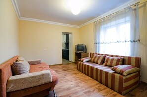Apartment | Living room | Flat-screen TV - Economy Apartment Doroshenka 48 (Lviv)