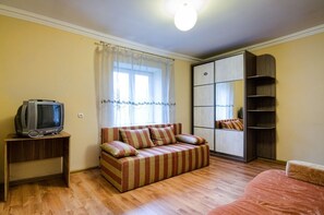 Apartment | Living area | Flat-screen TV - Economy Apartment Doroshenka 48 (Lviv)
