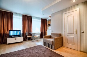 Apartment, Non Smoking | Living area | Flat-screen TV - Apartment Svobody 6-8a (Lviv)