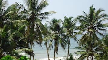 On the beach, surfing