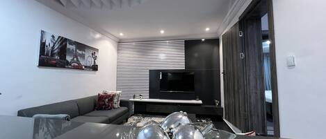 Apartment, 1 Bedroom | Living area | TV