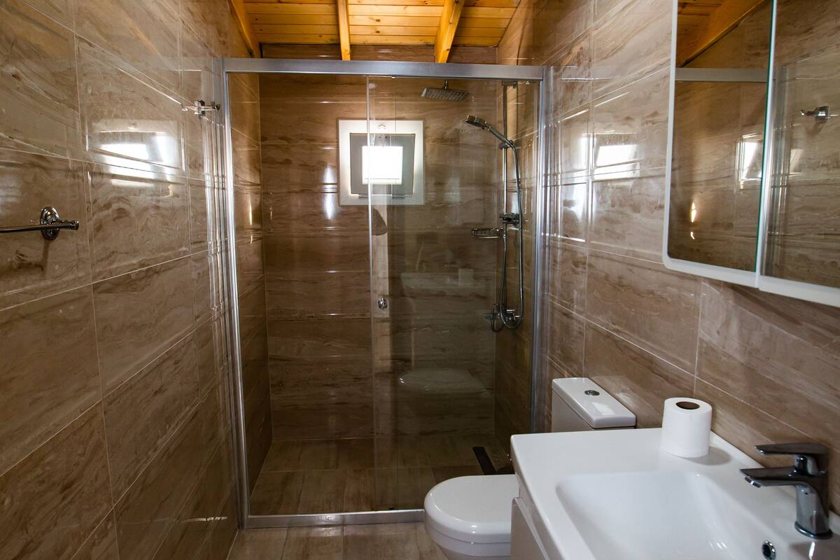 deluxe room, multiple beds, non smoking, sea view | bathroom | shower, rainfall showerhead, free toiletries, hair dryer