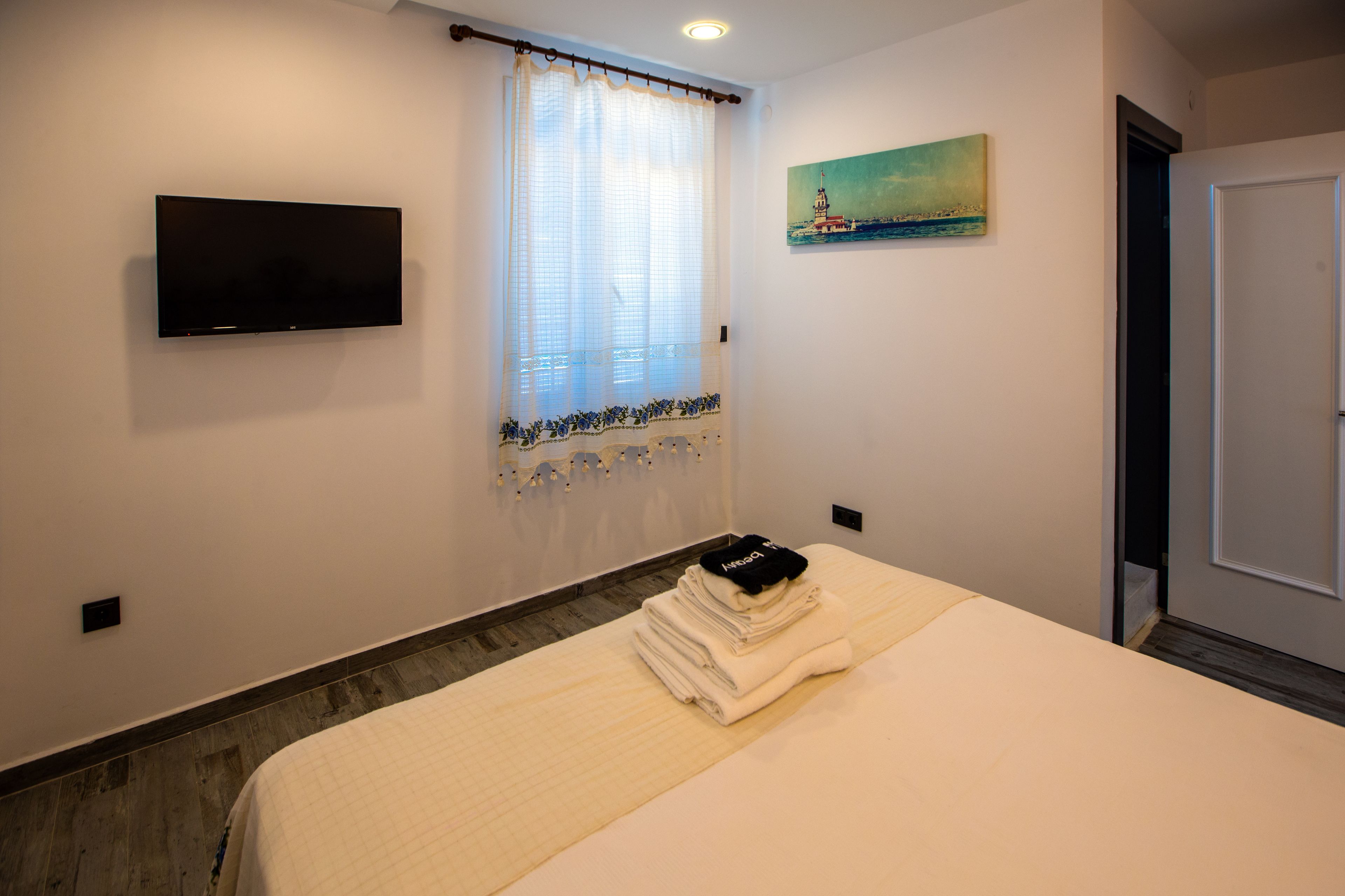 deluxe room, multiple beds, non smoking, sea view | free minibar, in-room safe, iron/ironing board, free wifi