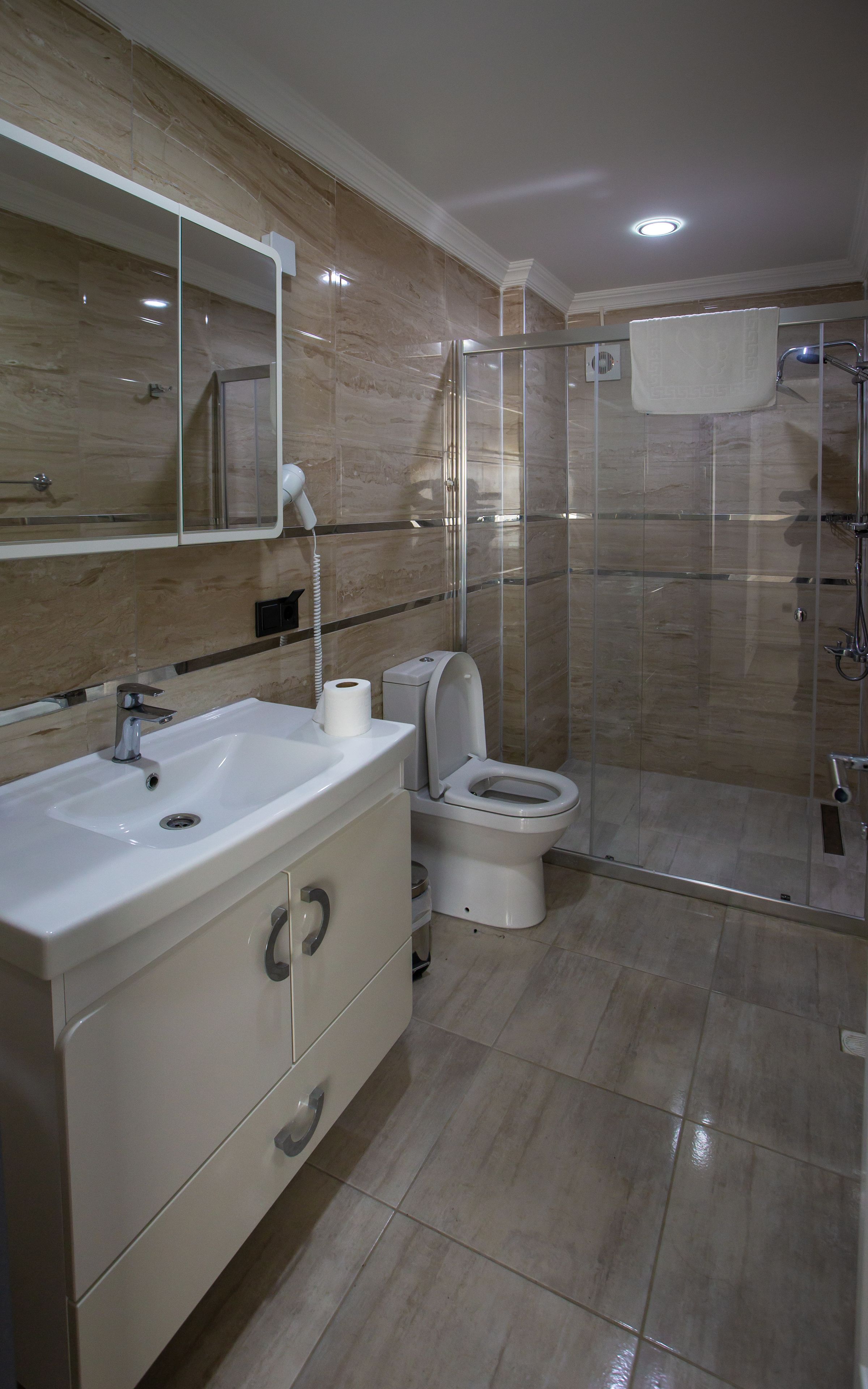 deluxe room, multiple beds, non smoking, sea view | bathroom | shower, rainfall showerhead, free toiletries, hair dryer