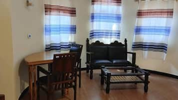 Superior Double Room, City View | Living area | TV