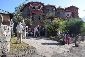 A historic building with multiple levels and a stone facade. - Bete Serkie Lalibela (Lalibela)