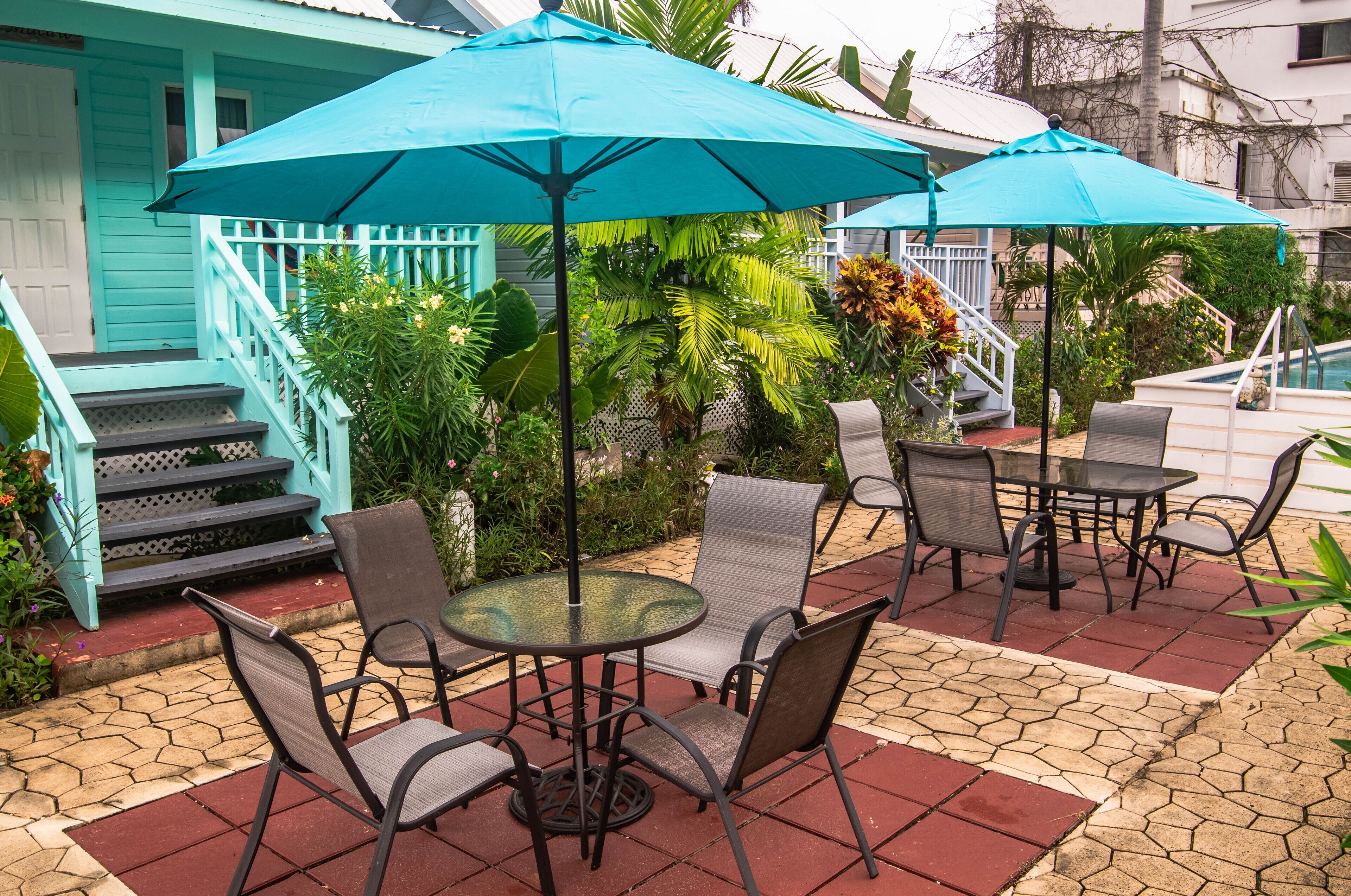 A patio area with outdoor seating and a pool.
