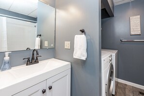 Combined shower/bathtub, hair dryer, towels, soap