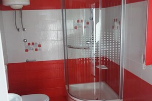 Shower, hair dryer, towels, toilet paper