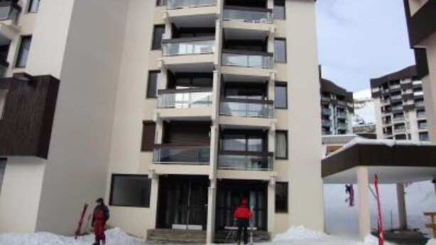 A multi-story residential building with balconies, a central entrance, and a snow-covered ground. - apartments - 2 rooms - 5/6 persons (Les Belleville)