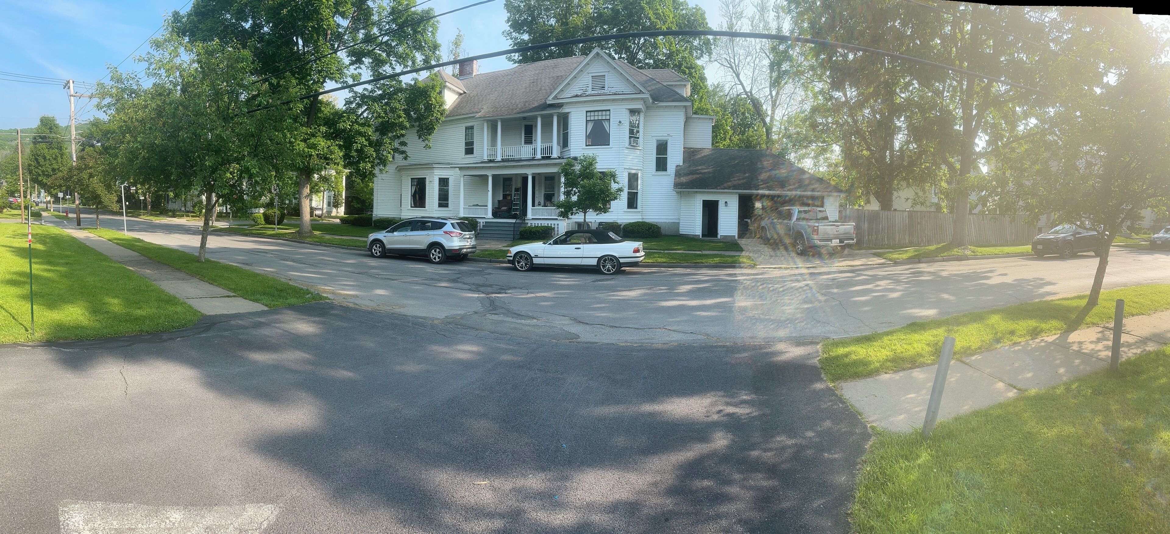 A two-story house with a porch and a garage.