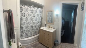 Combined shower/bathtub, hair dryer, towels, soap - 1st Class Rentals Munson Manor VII at Watkins Avenue (Oneonta)